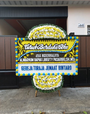 Papan Bunga Duka di Uwung Jaya